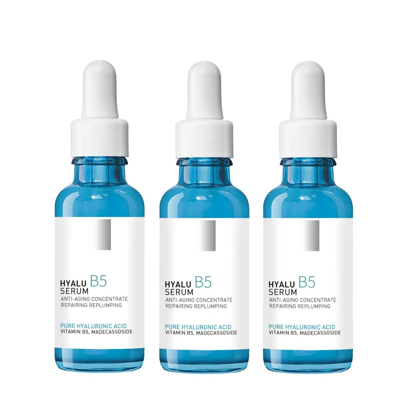 Three bottles of Hyalu B5 serum with dropper caps, labeled with hyaluronic acid and vitamin B5.